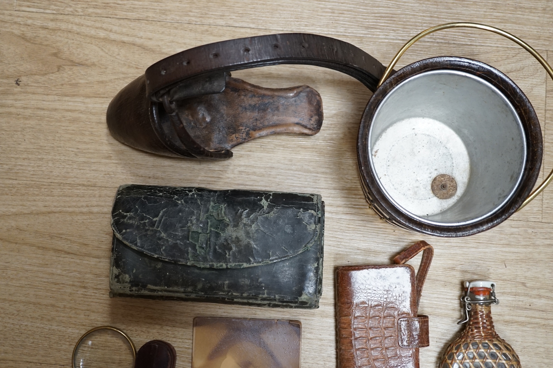 A collection of sundry items to include a fisherman's fly tying kit, a crocodile skin purse, a travelling inkwell, a miniature Steiff dog and a leather stirrup. etc. (9). Condition - mostly fair